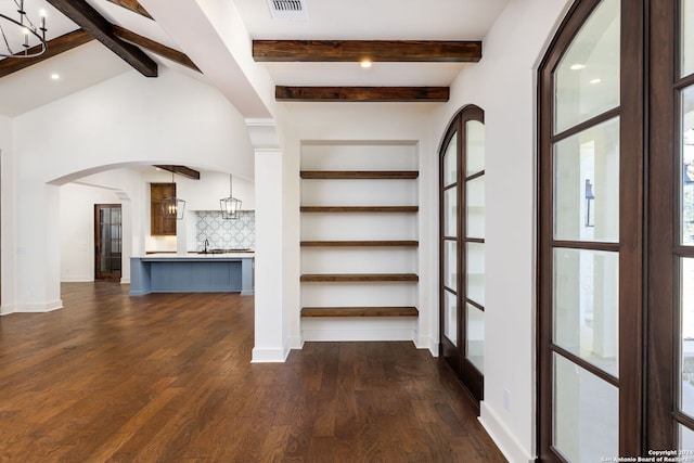 interior space with french doors, sink, dark hardwood / wood-style flooring, a notable chandelier, and vaulted ceiling with beams