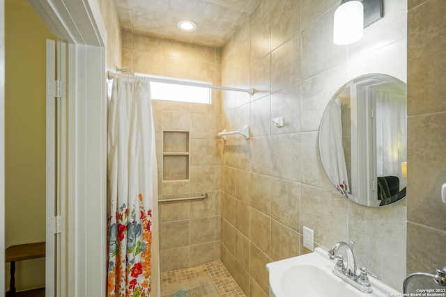 bathroom with a shower with curtain and sink