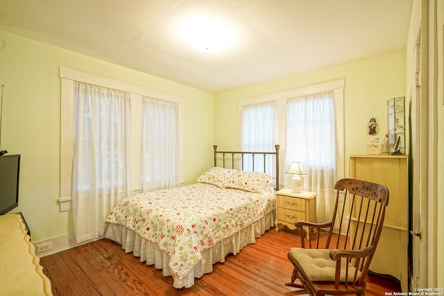 bedroom with light hardwood / wood-style flooring