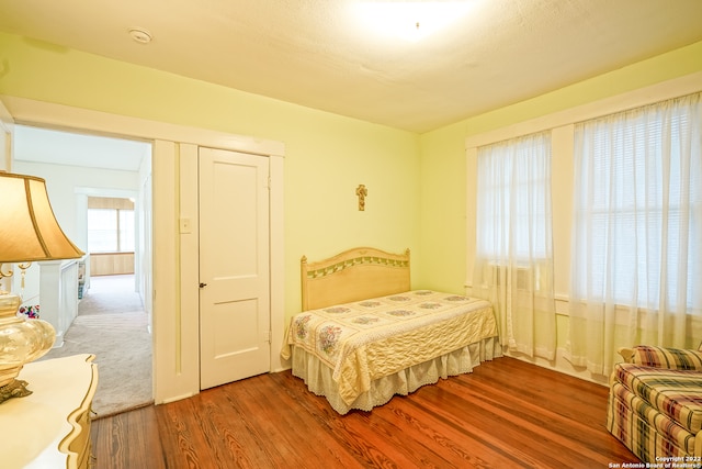 bedroom with wood-type flooring