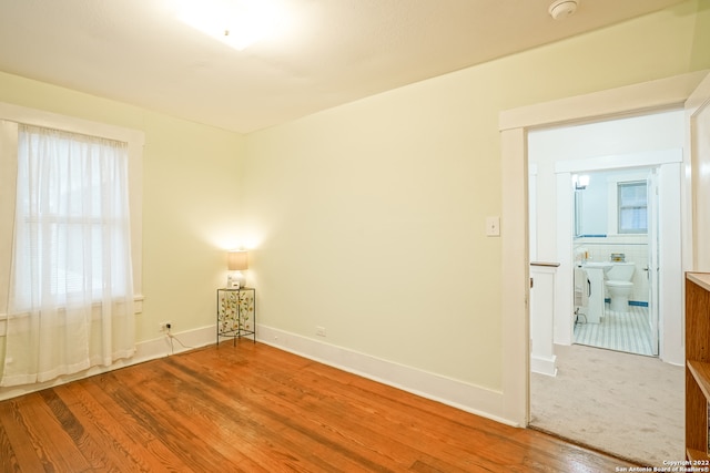 empty room with hardwood / wood-style floors