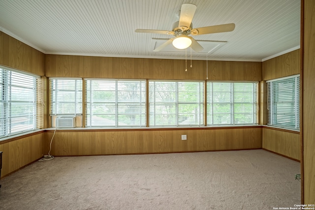 unfurnished sunroom featuring ceiling fan