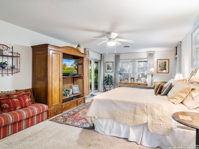 bedroom with ceiling fan and carpet floors