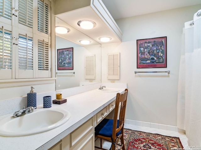 bathroom featuring tile patterned flooring and vanity