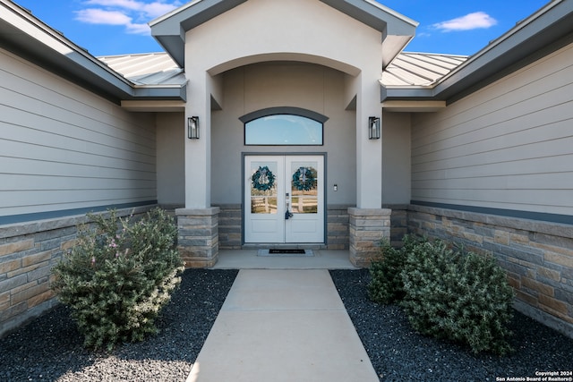 doorway to property featuring french doors