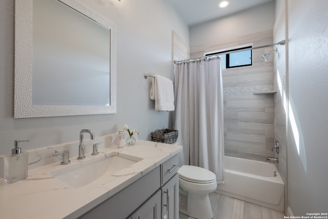 full bathroom with shower / bath combo, toilet, and vanity