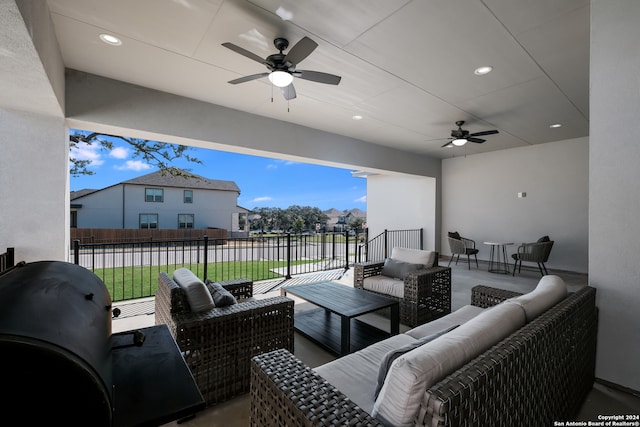 view of patio / terrace with an outdoor living space and ceiling fan