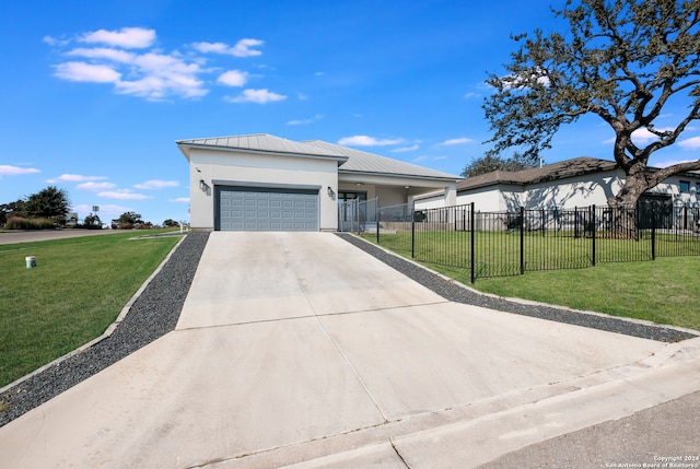 view of front facade featuring a front lawn and a garage