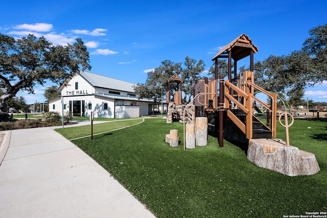 view of play area featuring a lawn