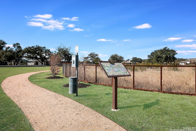 view of home's community featuring a lawn