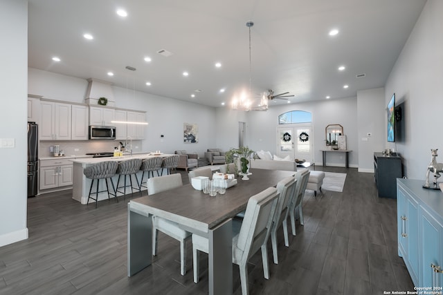 dining room featuring ceiling fan and dark hardwood / wood-style floors