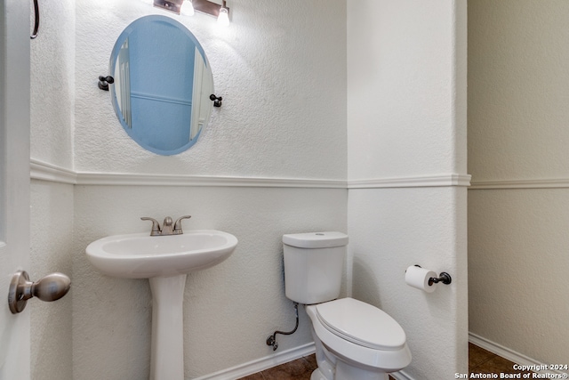 bathroom featuring sink and toilet