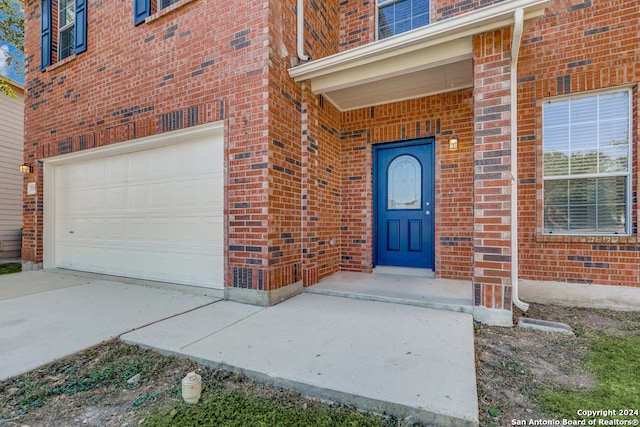 entrance to property featuring a garage