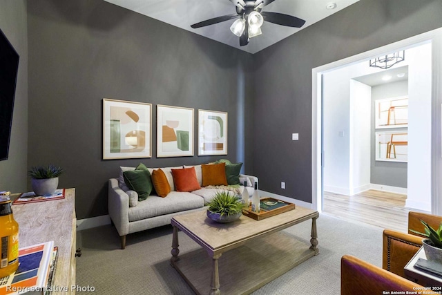 living room featuring ceiling fan and light carpet