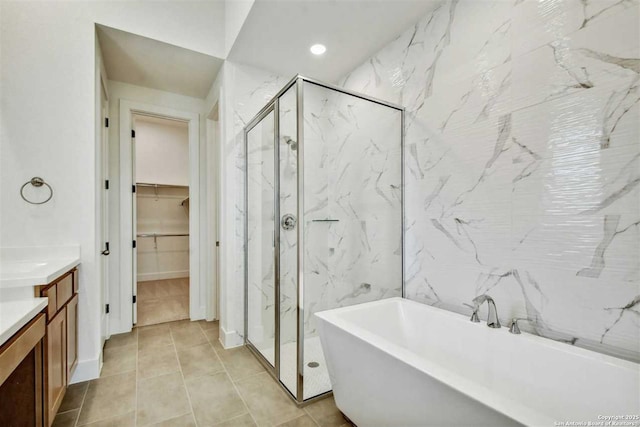 bathroom featuring independent shower and bath and vanity