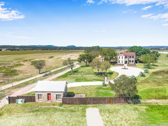 drone / aerial view featuring a mountain view and a rural view