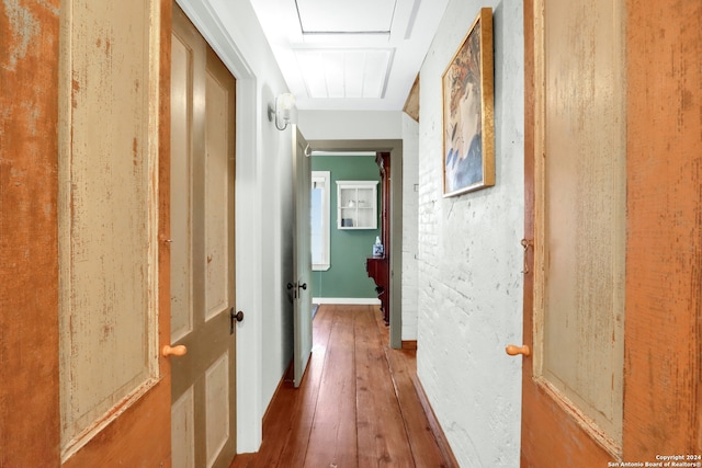 corridor featuring wood-type flooring