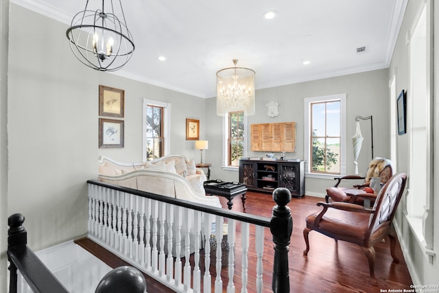 interior space featuring a notable chandelier, a wealth of natural light, and hardwood / wood-style floors