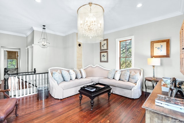 living room featuring a notable chandelier, dark hardwood / wood-style floors, and crown molding