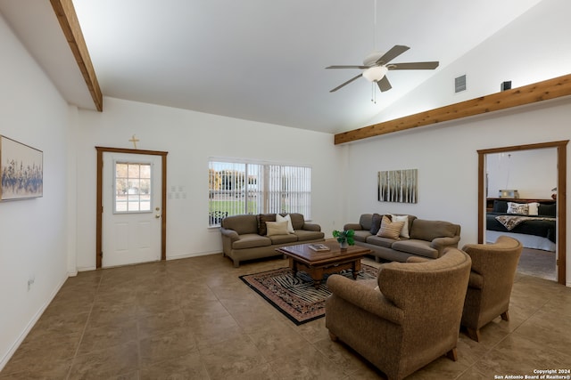 tiled living room with ceiling fan and high vaulted ceiling