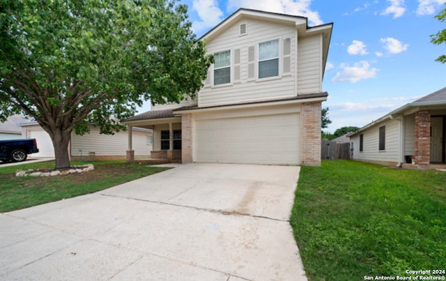 front facade with a garage and a front lawn