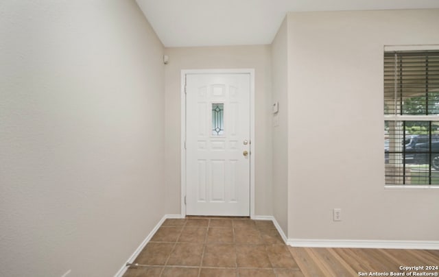 doorway to outside with hardwood / wood-style floors