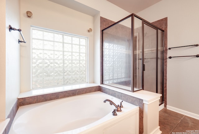 bathroom with plus walk in shower and tile patterned flooring