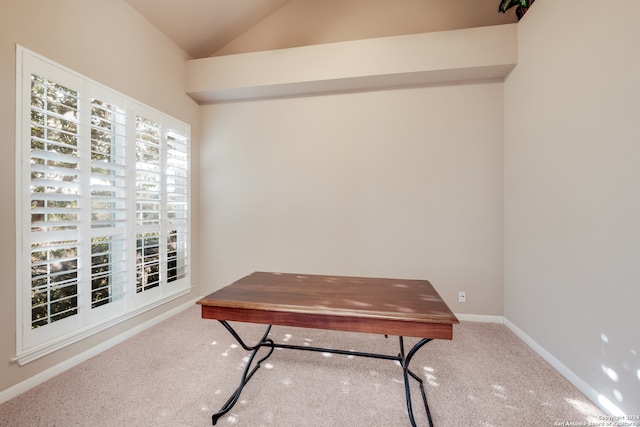 carpeted office space with lofted ceiling