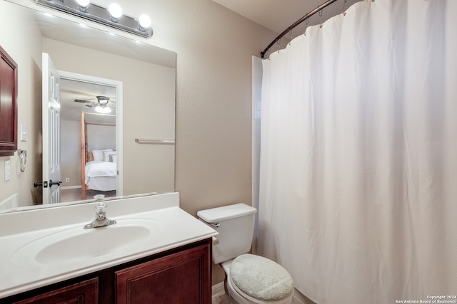 bathroom featuring ceiling fan, vanity, and toilet