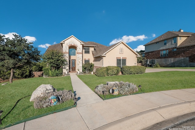 view of front of property with a front lawn