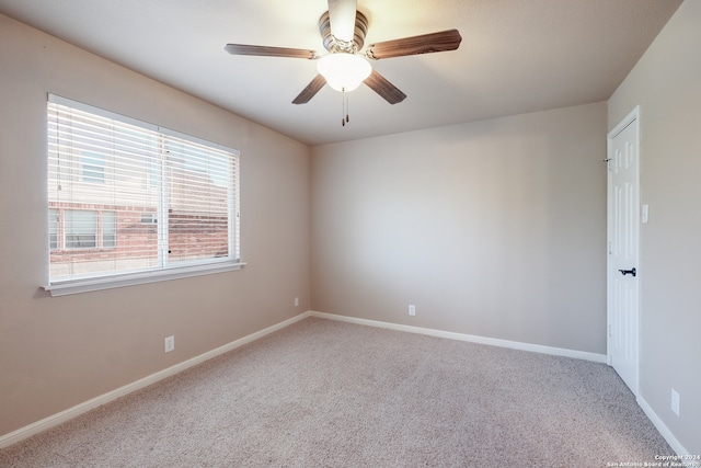 empty room featuring carpet and ceiling fan