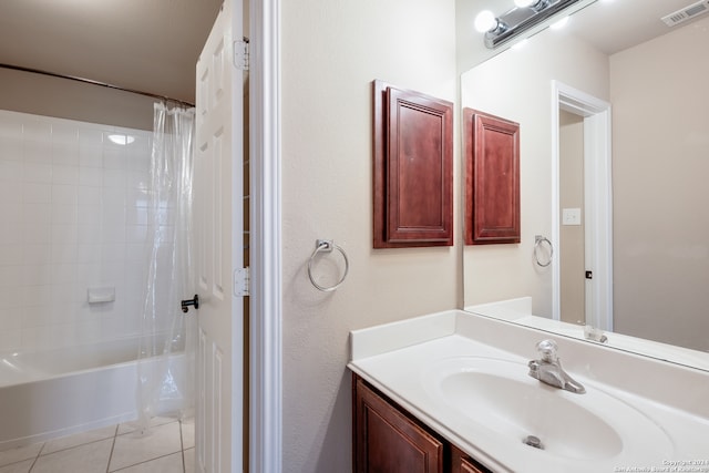 bathroom featuring shower / bathtub combination with curtain, tile patterned flooring, and vanity