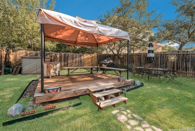 view of yard featuring a gazebo and a wooden deck