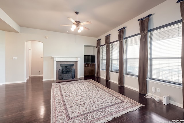 living room featuring dark hardwood / wood-style floors and ceiling fan