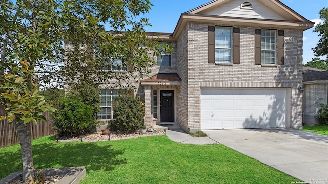 view of front facade featuring a garage and a front yard