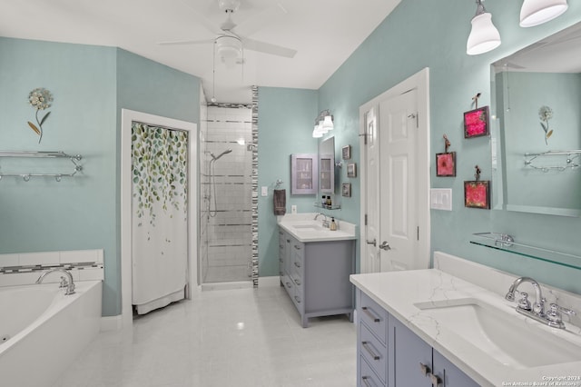 bathroom featuring tile patterned flooring, ceiling fan, vanity, and separate shower and tub