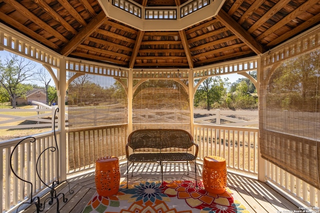 wooden terrace featuring a gazebo