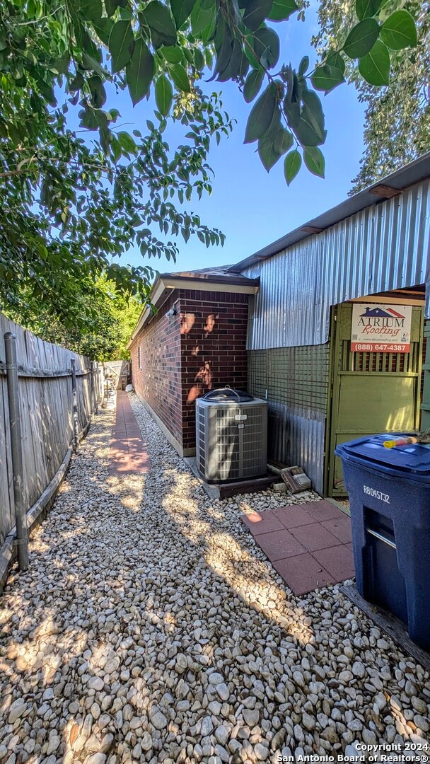 view of yard featuring central air condition unit