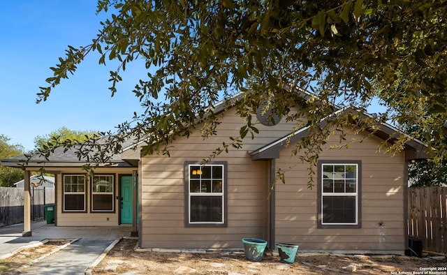 rear view of property featuring a patio