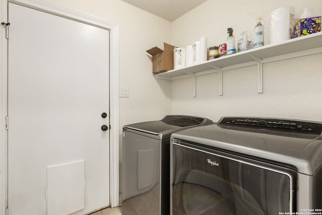 clothes washing area with separate washer and dryer