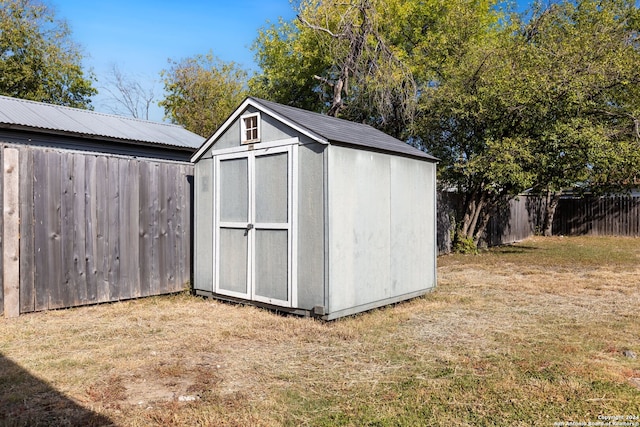 view of outdoor structure with a lawn