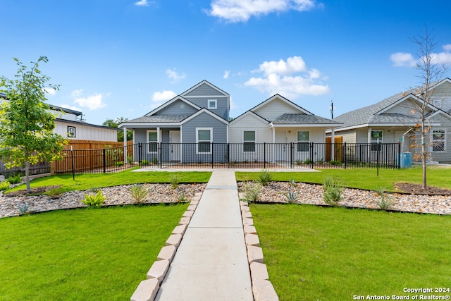 bungalow-style house featuring a front yard