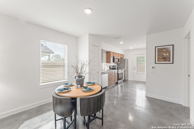 dining space with sink