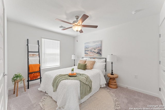 carpeted bedroom with ceiling fan