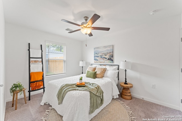 bedroom with light carpet and ceiling fan