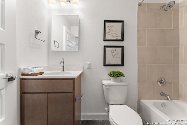 full bathroom with tiled shower / bath combo, vanity, and toilet