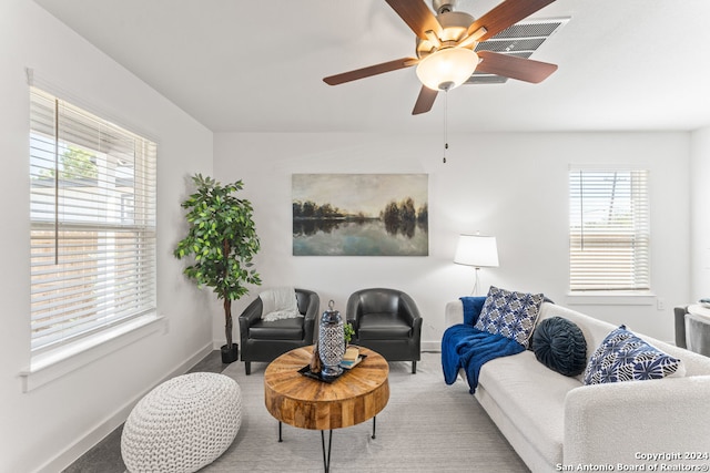 living room featuring ceiling fan and carpet floors