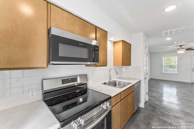 kitchen with backsplash, ceiling fan, appliances with stainless steel finishes, and sink