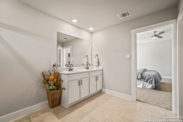 bathroom with tile patterned floors, ceiling fan, and vanity