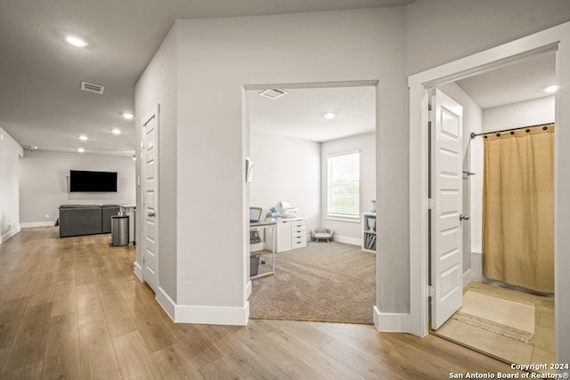 hallway featuring hardwood / wood-style floors